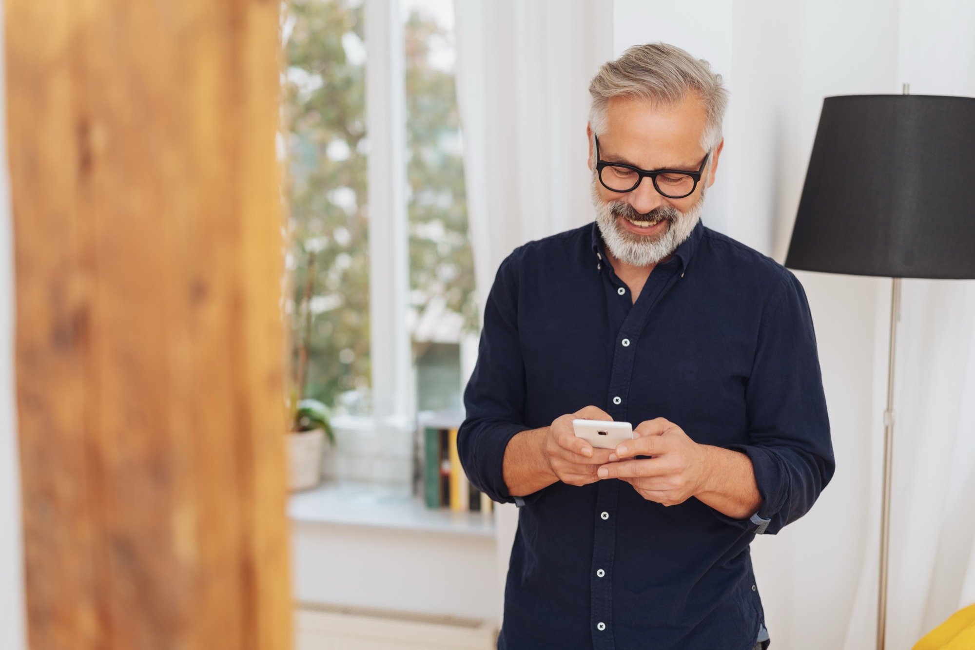 SYC Customer_ Male with glasses on phone