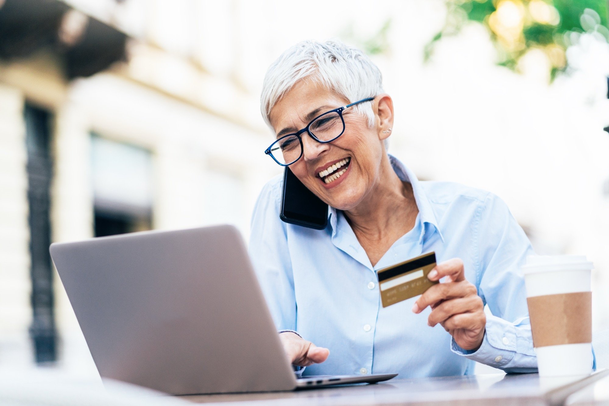 SYC _ Customer Consumer on Phone with Credit Card iStock-1187785569