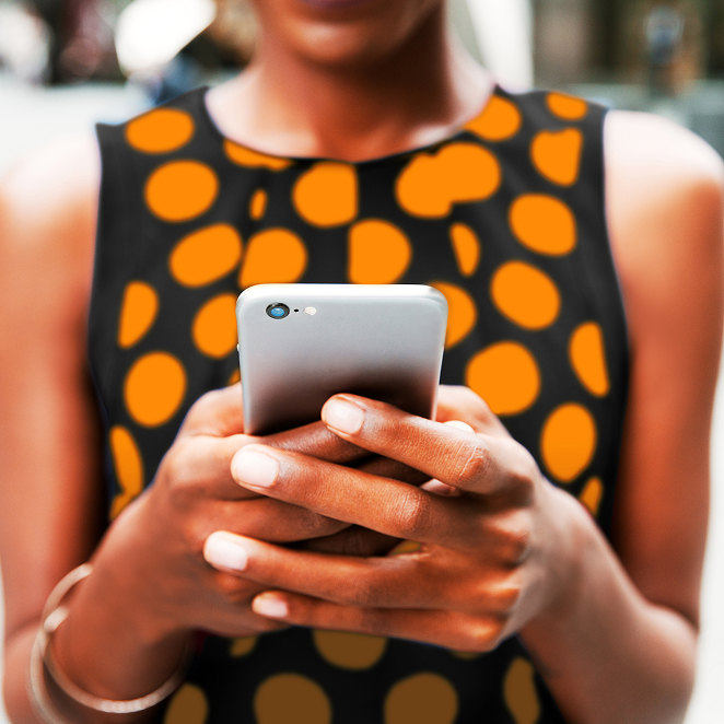 Female holding phone- orange dots 1